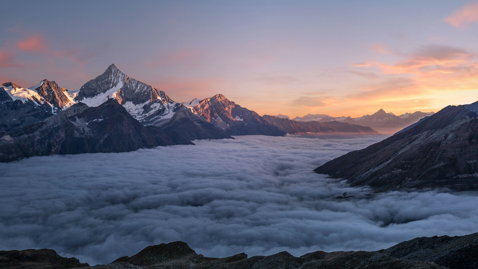 Grayscale mountain landscape with serene waters - representing the strategic depth and clarity of enterprise talent acquisition